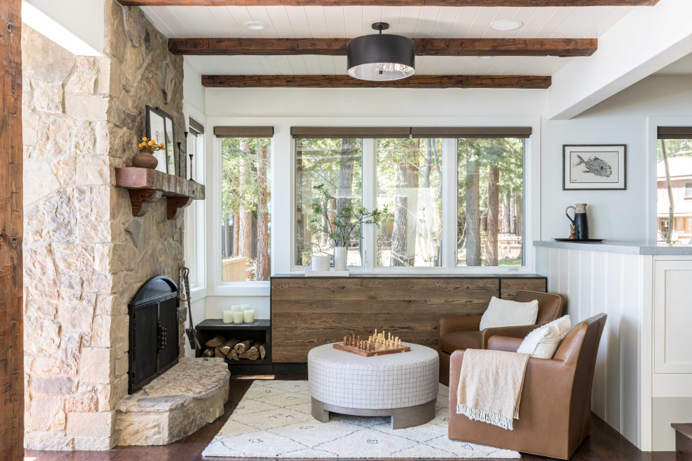 Inspiration for a rustic dark wood floor, brown floor, exposed beam and shiplap ceiling family room remodel with white walls