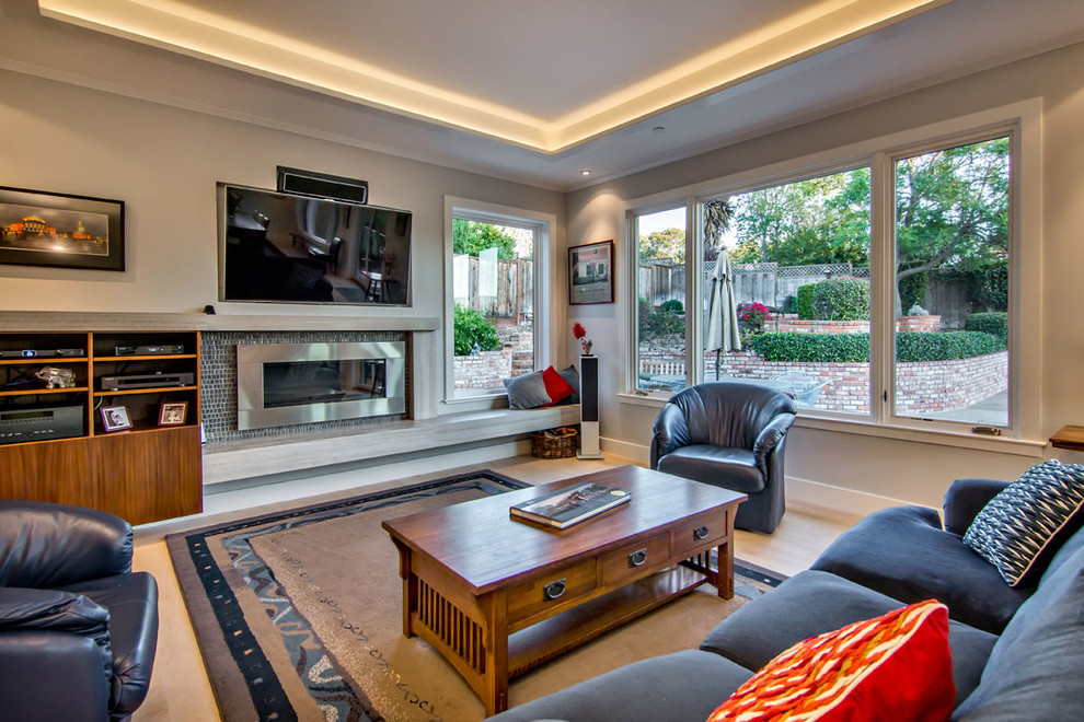 Photo of a contemporary living room in San Francisco with a ribbon fireplace and a built-in media wall.