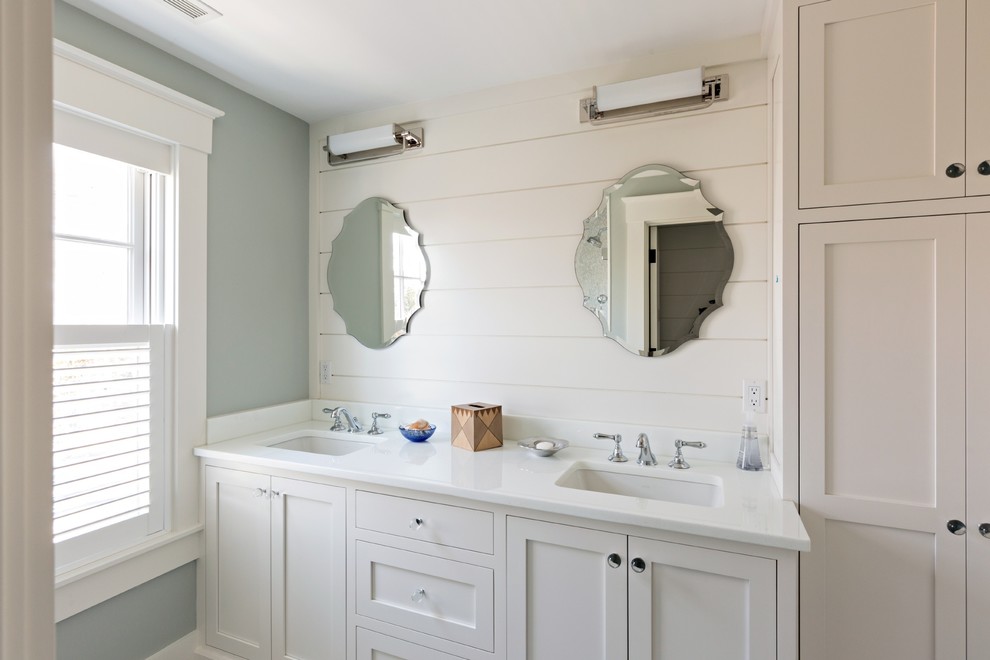 Mid-sized beach style 3/4 bathroom in Boston with beaded inset cabinets, white cabinets, a corner shower, blue tile, white tile, mosaic tile, white walls, porcelain floors, an undermount sink and engineered quartz benchtops.