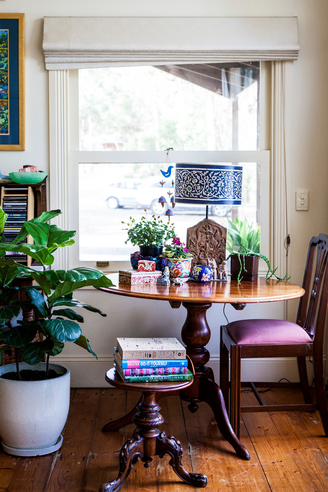 This is an example of an eclectic dining room in Melbourne.