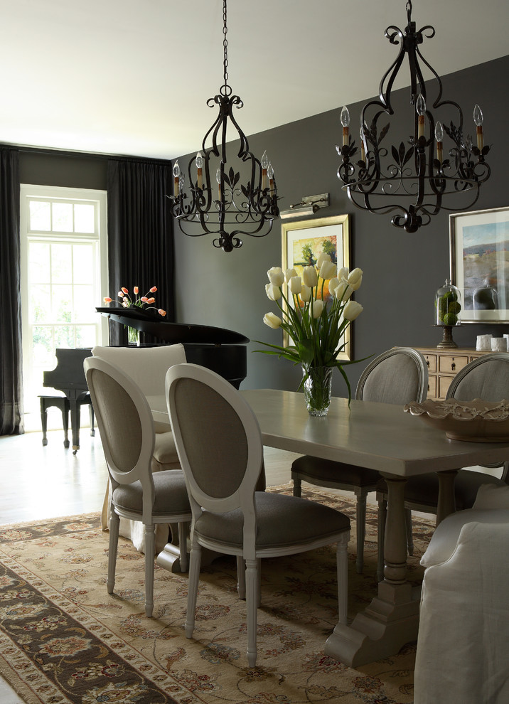 Traditional dining room in Atlanta with black walls.