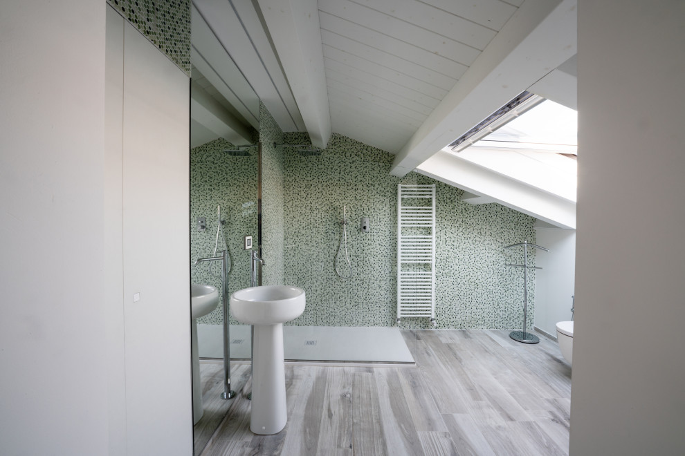 Large contemporary 3/4 bathroom in Other with a corner shower, a two-piece toilet, green tile, glass tile, white walls, wood-look tile, a pedestal sink, grey floor, an open shower, a single vanity and wood.