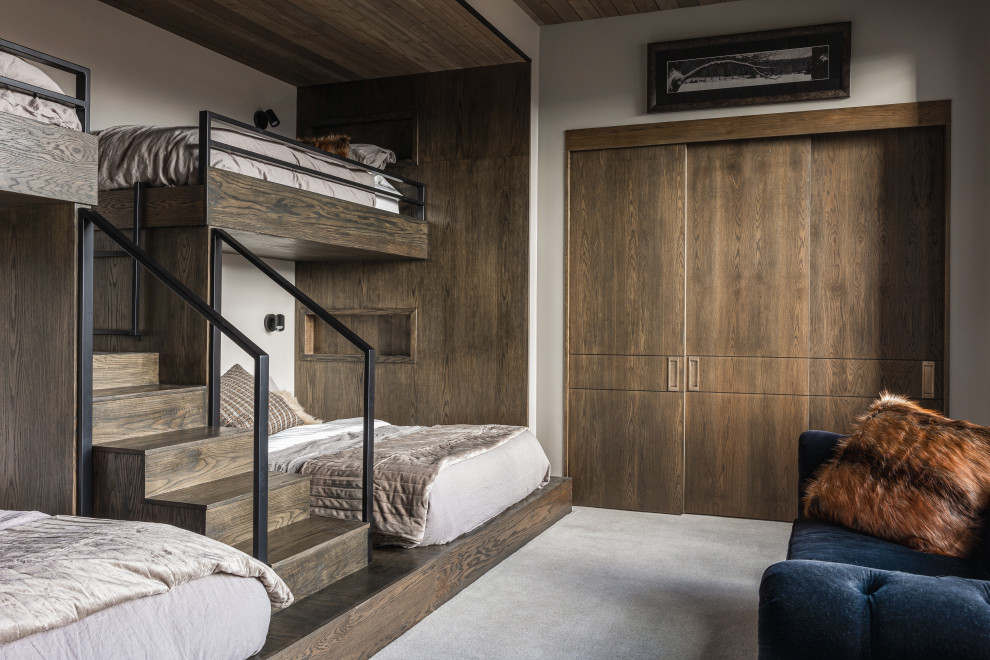 Cloudveil - Poised within the exclusive Dancing Sun neighborhood of Tuhaye, Cloudveil is a 5,820-square-foot statement of elevated living — a refined mountain retreat where modern architecture, rich materiality, and natural serenity converge.
With four bedrooms, four and a half bathrooms, and a design that embraces both comfort and sophistication, Cloudveil delivers a deeply personal take on luxury. The interiors reflect a masculine, modern aesthetic, marked by clean lines, grounded textures, and a restrained elegance.
Anchoring the home is a dramatic open-concept living area, where custom Burchette & Burchette wood flooring sets the tone for timeless quality underfoot. Expansive glazing brings in filtered mountain light, evoking the home's namesake — soft, shifting veils of cloud that dance across the landscape. Bespoke lighting and tailored finishes amplify the home’s curated ambiance.
For the wellness-minded, Cloudveil features a private spa sanctuary, complete with a custom sauna designed to soothe and restore. A dedicated golf simulator suite offers both leisure and precision, while generous gathering spaces — both indoors and out — encourage year-round entertaining. Fire features, intimate lounges, and mountain views make every moment immersive.
Thoughtful details include an integrated smart lighting system, luxurious bath fixtures, and handcrafted millwork throughout — all chosen to enhance both the daily rhythm and the visual serenity of the home.
Cloudveil is more than a home. It is a high-altitude haven — a quiet, powerful presence nestled in the Wasatch, where every element is designed not just to impress, but to endure.

Architecture: BERG Design
Interior Architecture: BERG Design