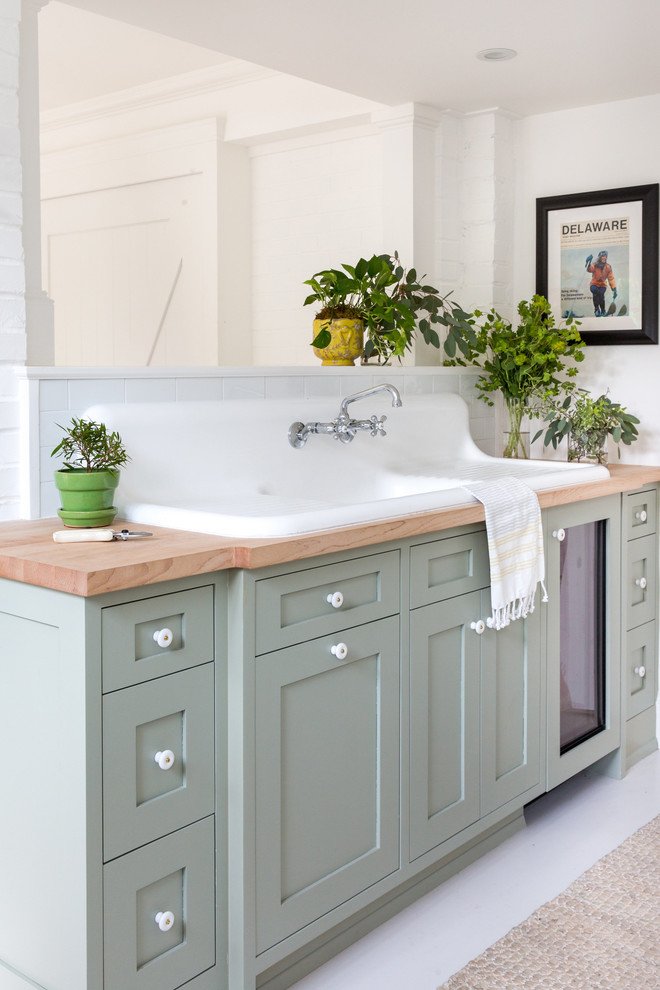 Inspiration for a small country kids bathroom in Raleigh with shaker cabinets, grey cabinets, a corner shower, white walls, a drop-in sink, wood benchtops, white floor, a hinged shower door and brown benchtops.