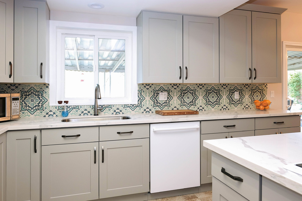Design ideas for a small traditional l-shaped eat-in kitchen in Los Angeles with a drop-in sink, shaker cabinets, grey cabinets, quartz benchtops, blue splashback, cement tile splashback, white appliances, ceramic floors, no island and pink floor.
