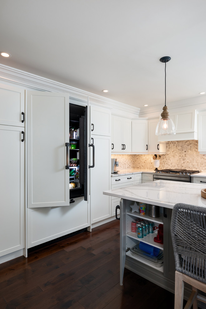 Kitchen - transitional dark wood floor and brown floor kitchen idea with white cabinets, quartz countertops, paneled appliances, an island and white countertops
