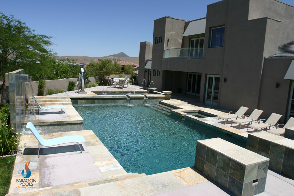 Large contemporary backyard custom-shaped pool in Las Vegas.