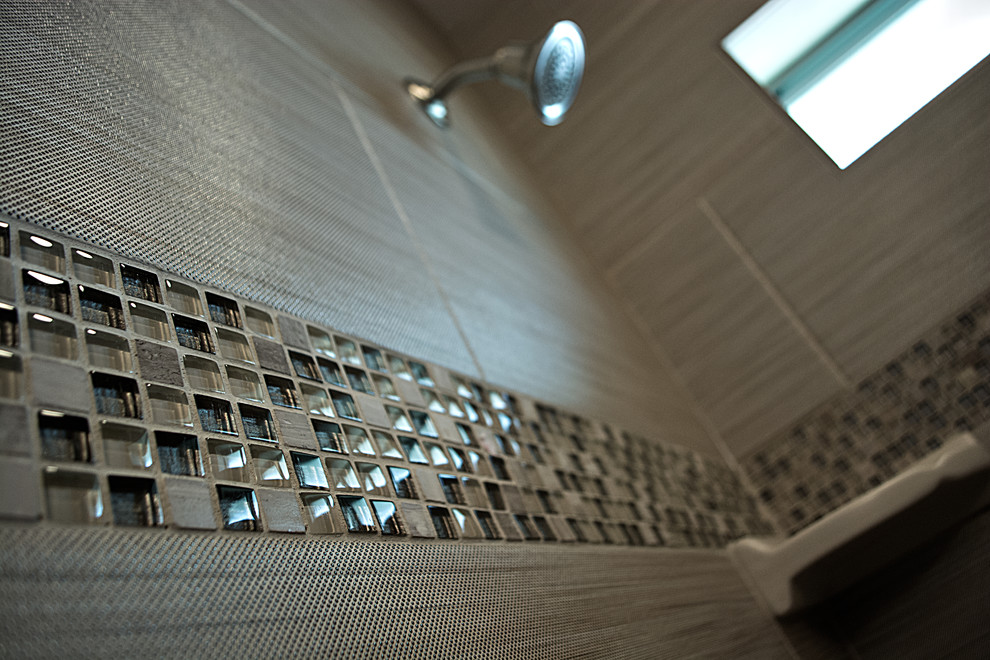 Inspiration for a mid-sized transitional beige tile and porcelain tile porcelain tile home design remodel in Austin with a vessel sink, flat-panel cabinets, dark wood cabinets and quartzite countertops