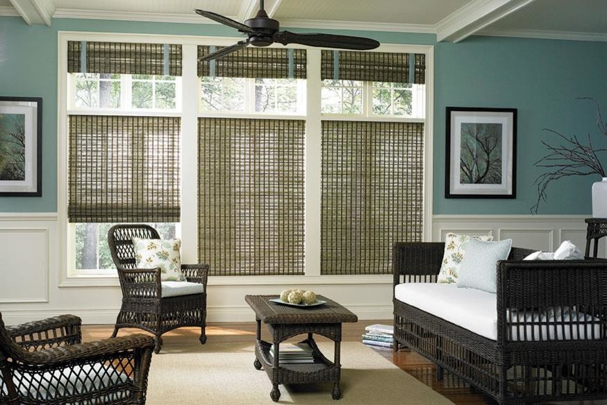 Design ideas for a tropical sunroom in Charleston with medium hardwood floors and a standard ceiling.
