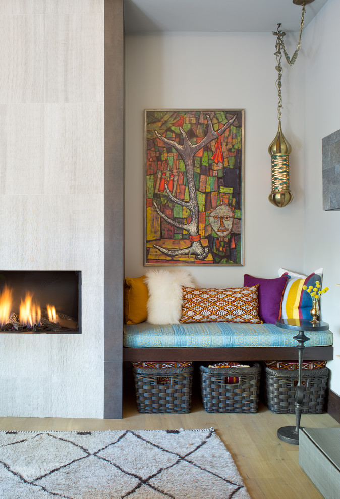 Living room - eclectic light wood floor and beige floor living room idea in Denver with white walls, a standard fireplace, a stone fireplace and no tv