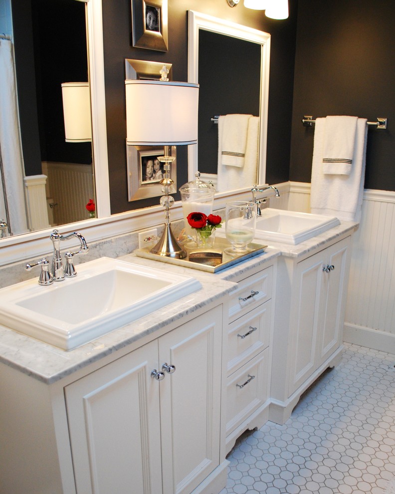 This is an example of a traditional bathroom in Boise with mosaic tile, a drop-in sink and black walls.