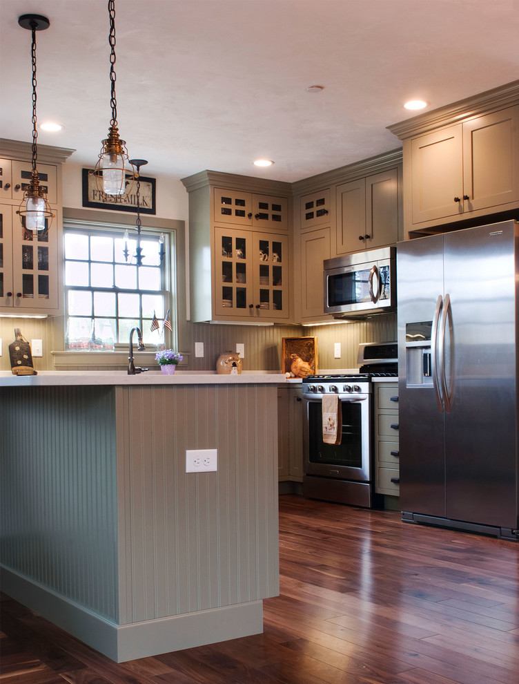 This is an example of a mid-sized country kitchen in Boston.