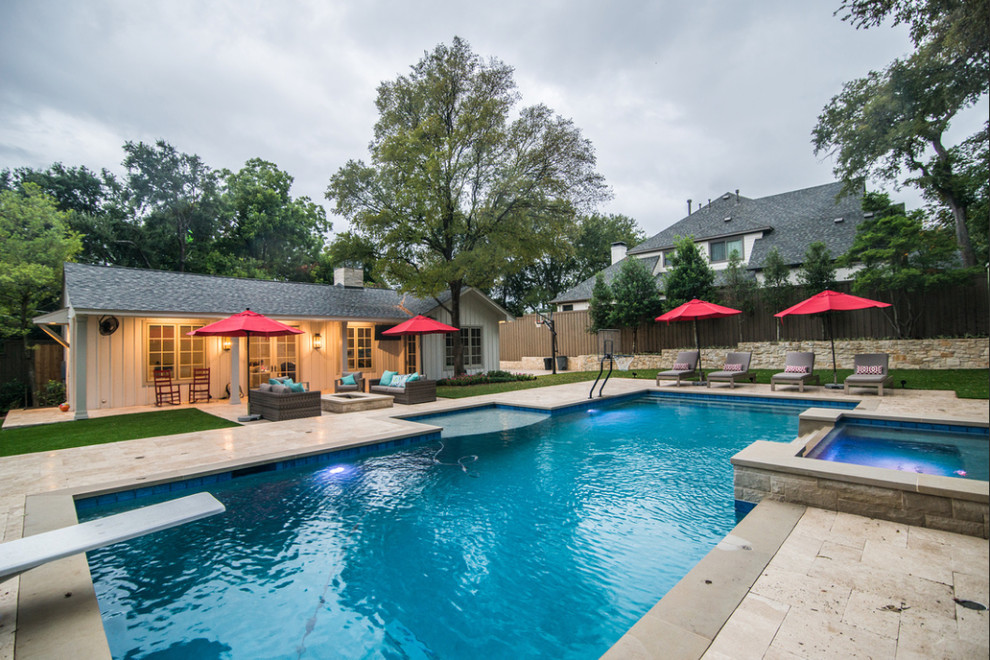Large transitional backyard rectangular lap pool in Dallas with a hot tub and tile.