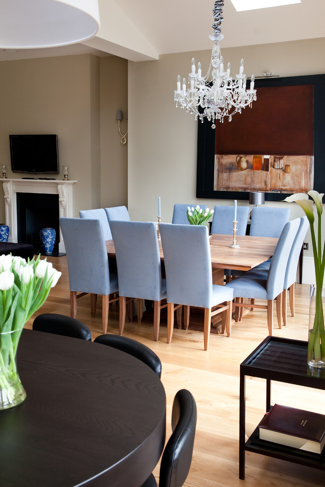 This is an example of an expansive traditional dining room in London.