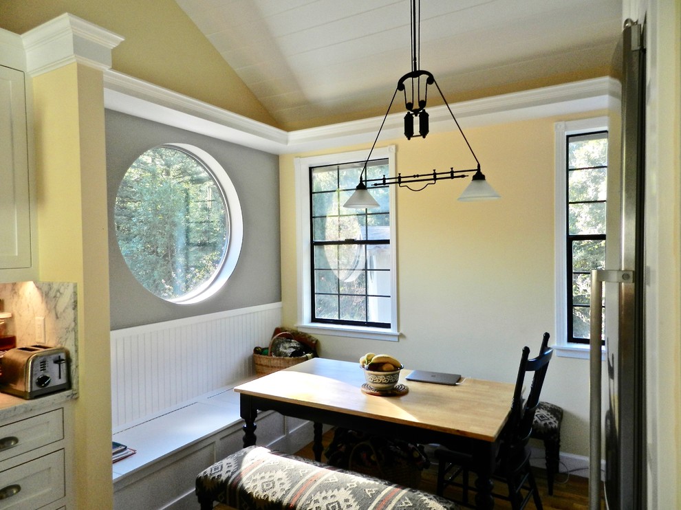 Inspiration for a small country dining room in Other with medium hardwood floors and brown floor.