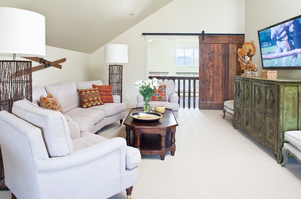 Mountain style enclosed carpeted family room photo in Denver with a wall-mounted tv, white walls and no fireplace