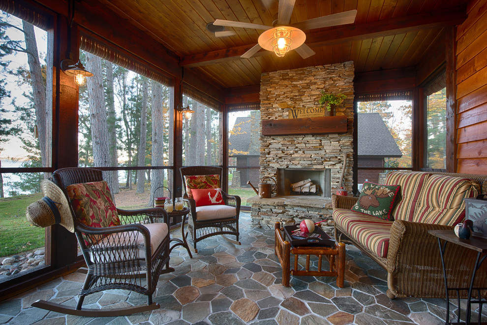 Design ideas for a country screened-in verandah in Minneapolis with a roof extension.