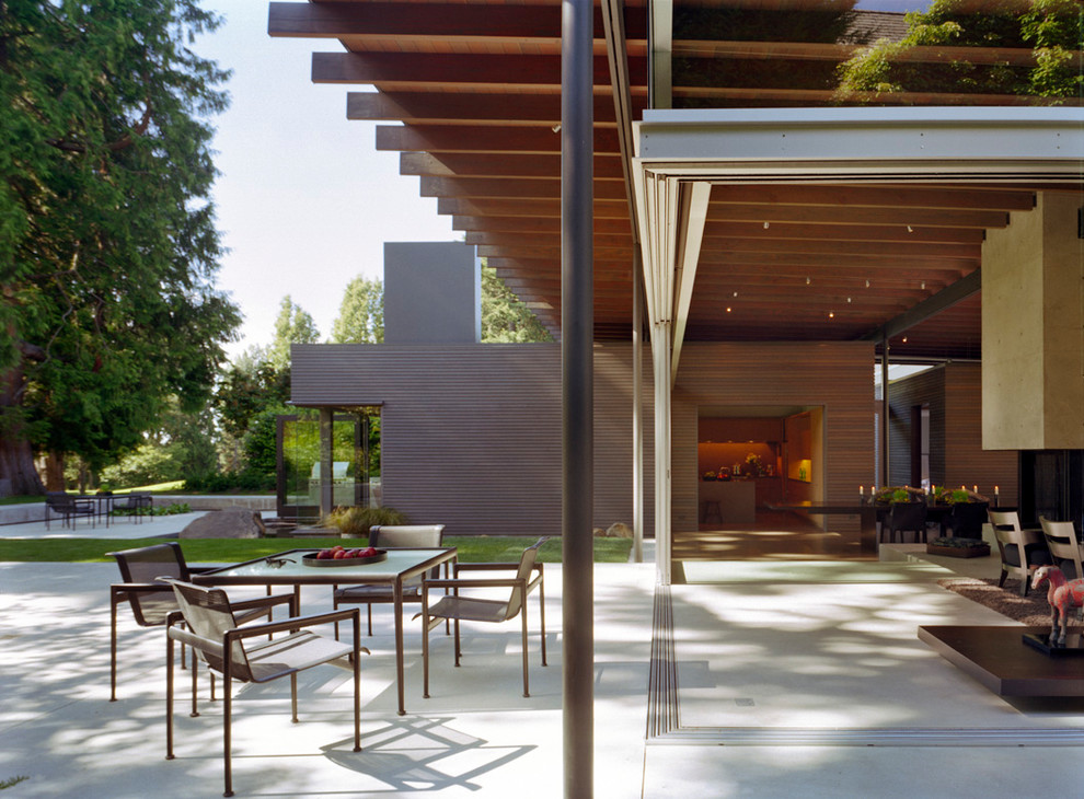 This is an example of a modern patio in Seattle with a fire feature.