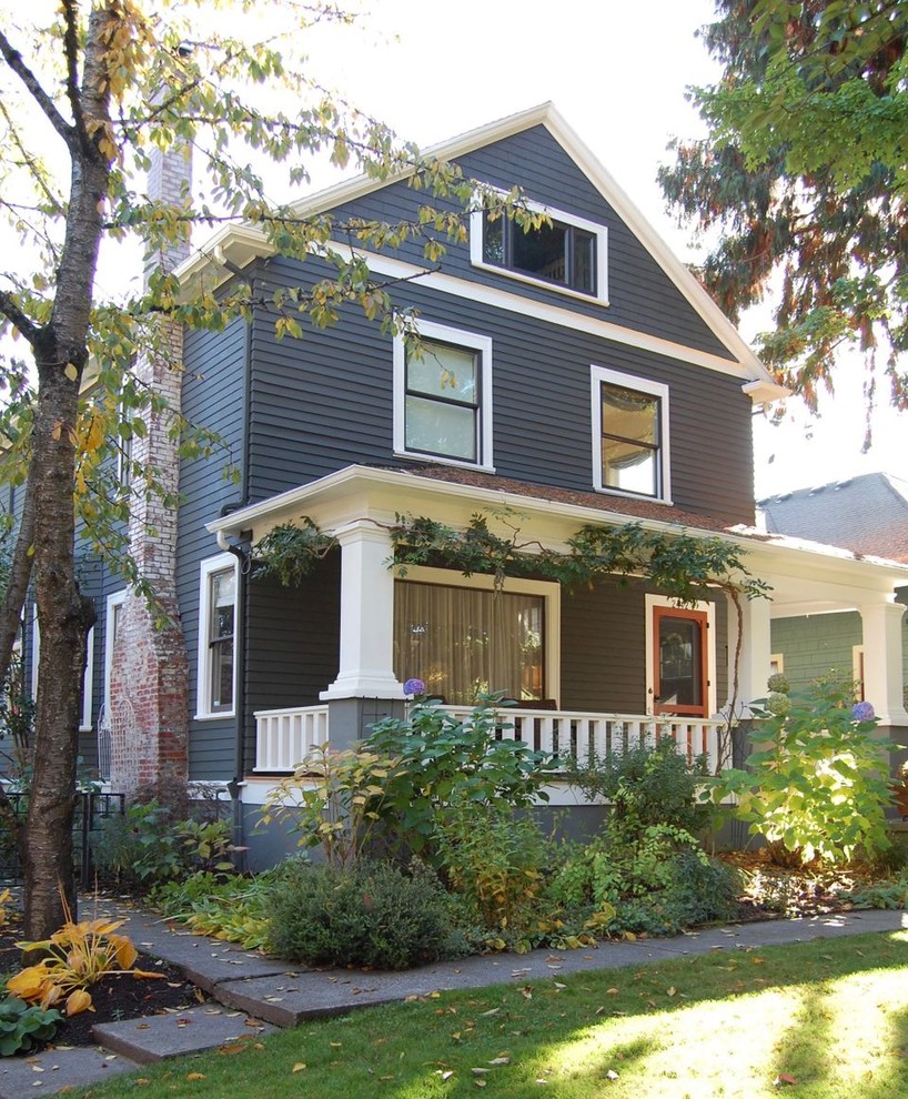 Traditional two-storey grey house exterior in Portland with a gable roof.