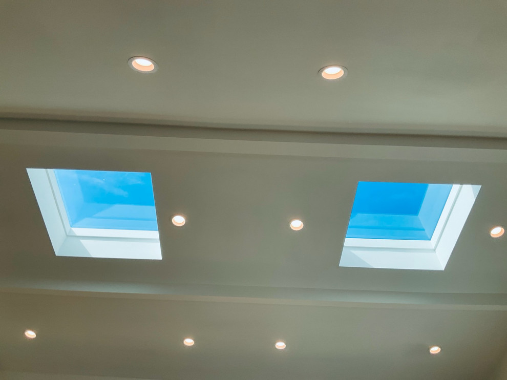 Vaulted ceiling skylights, folding door front doors