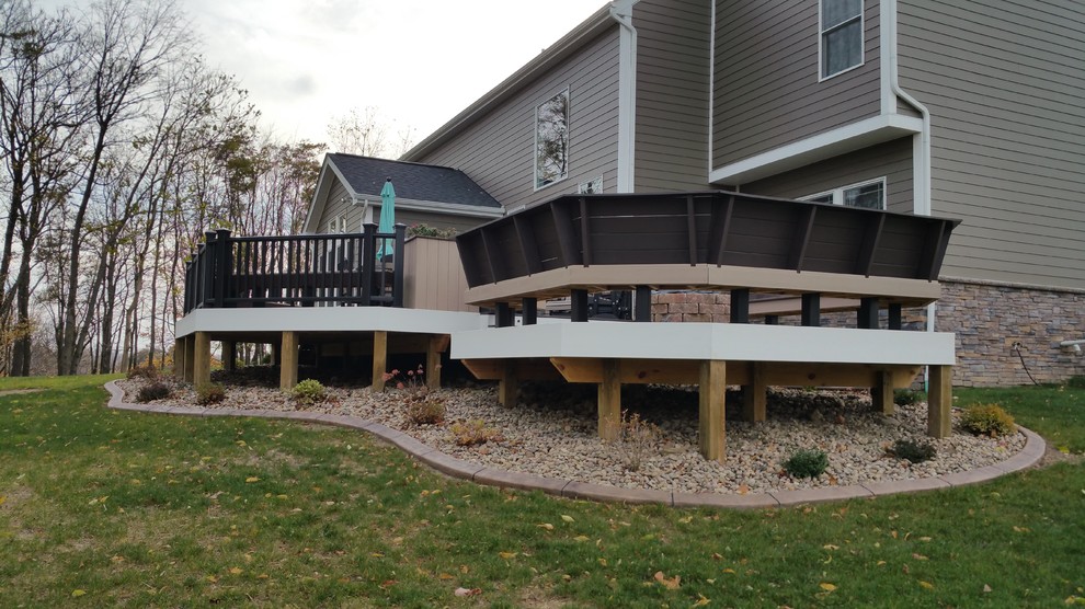 Deck - large modern backyard deck idea with a fire pit and no cover