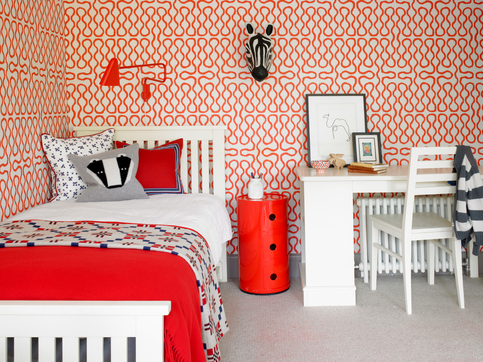 This is an example of a contemporary gender-neutral kids' bedroom for kids 4-10 years old in London with carpet, beige floor and multi-coloured walls.