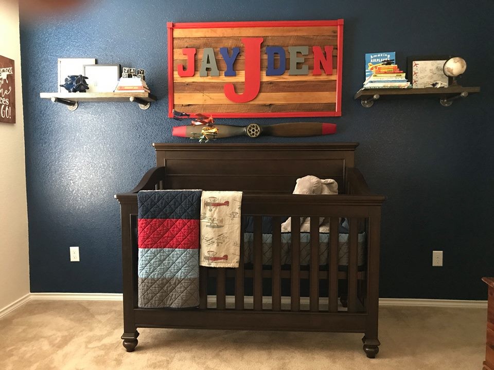 Inspiration for a mid-sized transitional nursery for boys in Dallas with multi-coloured walls, carpet and beige floor.