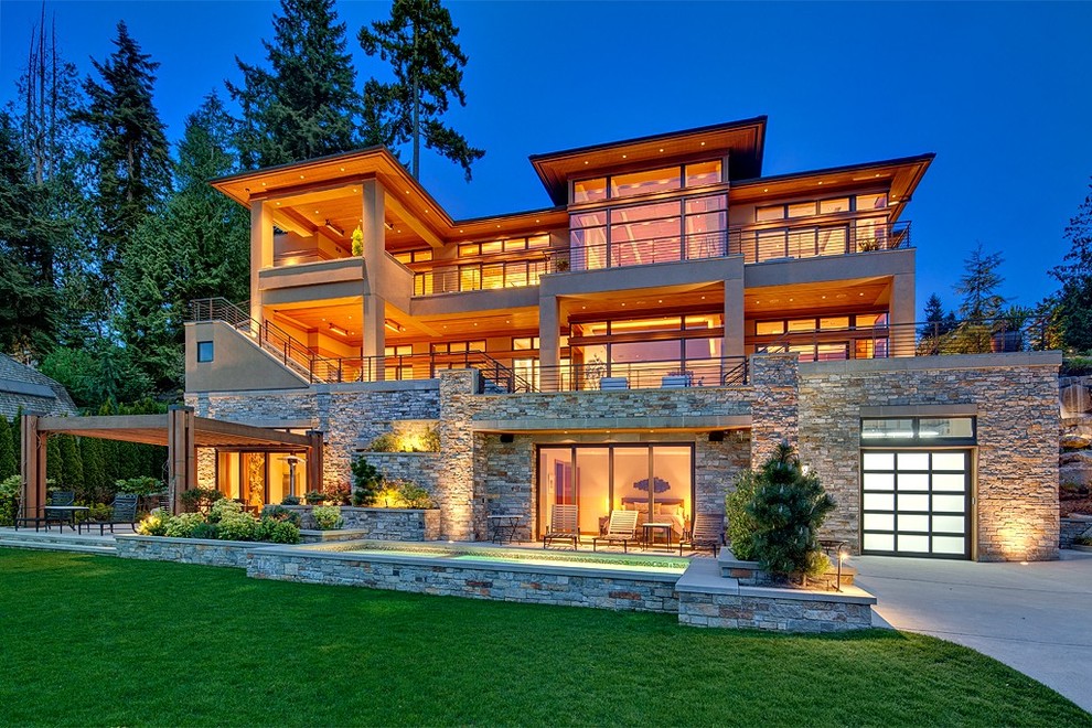 This is an example of a contemporary three-storey exterior in Seattle with a hip roof.