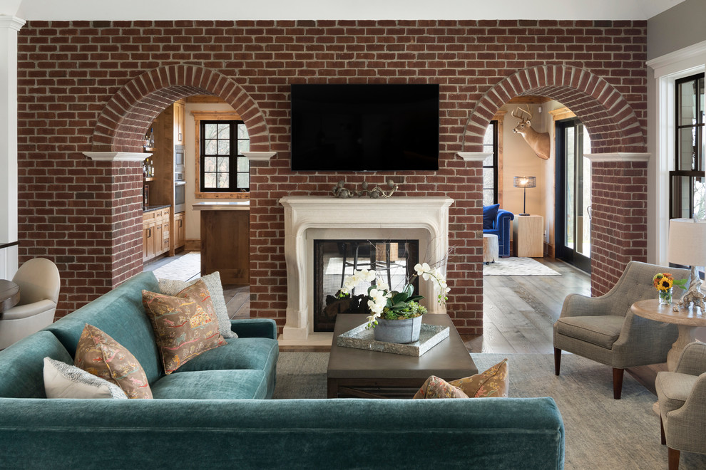 Inspiration for a traditional enclosed family room in Minneapolis with grey walls, dark hardwood floors, a two-sided fireplace and a wall-mounted tv.