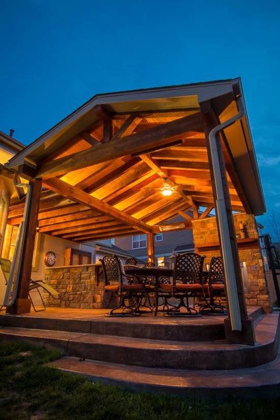 Inspiration for a backyard deck remodel in Denver with a pergola