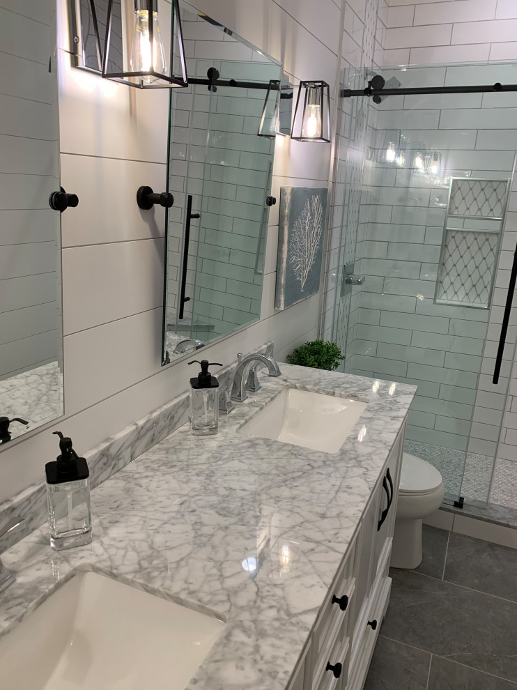 Design ideas for a medium sized classic bathroom in Sacramento with freestanding cabinets, white cabinets, an alcove shower, white tiles, ceramic tiles, white walls, ceramic flooring, a submerged sink, marble worktops, grey floors, a sliding door, grey worktops, a shower bench, double sinks, a freestanding vanity unit and tongue and groove walls.