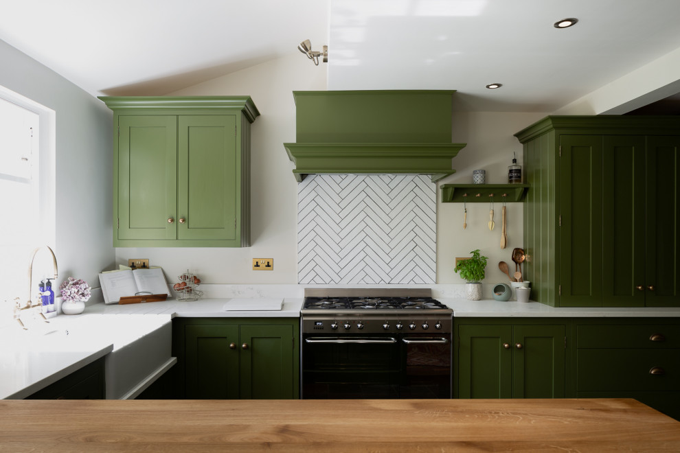This is an example of a transitional kitchen in Hertfordshire.