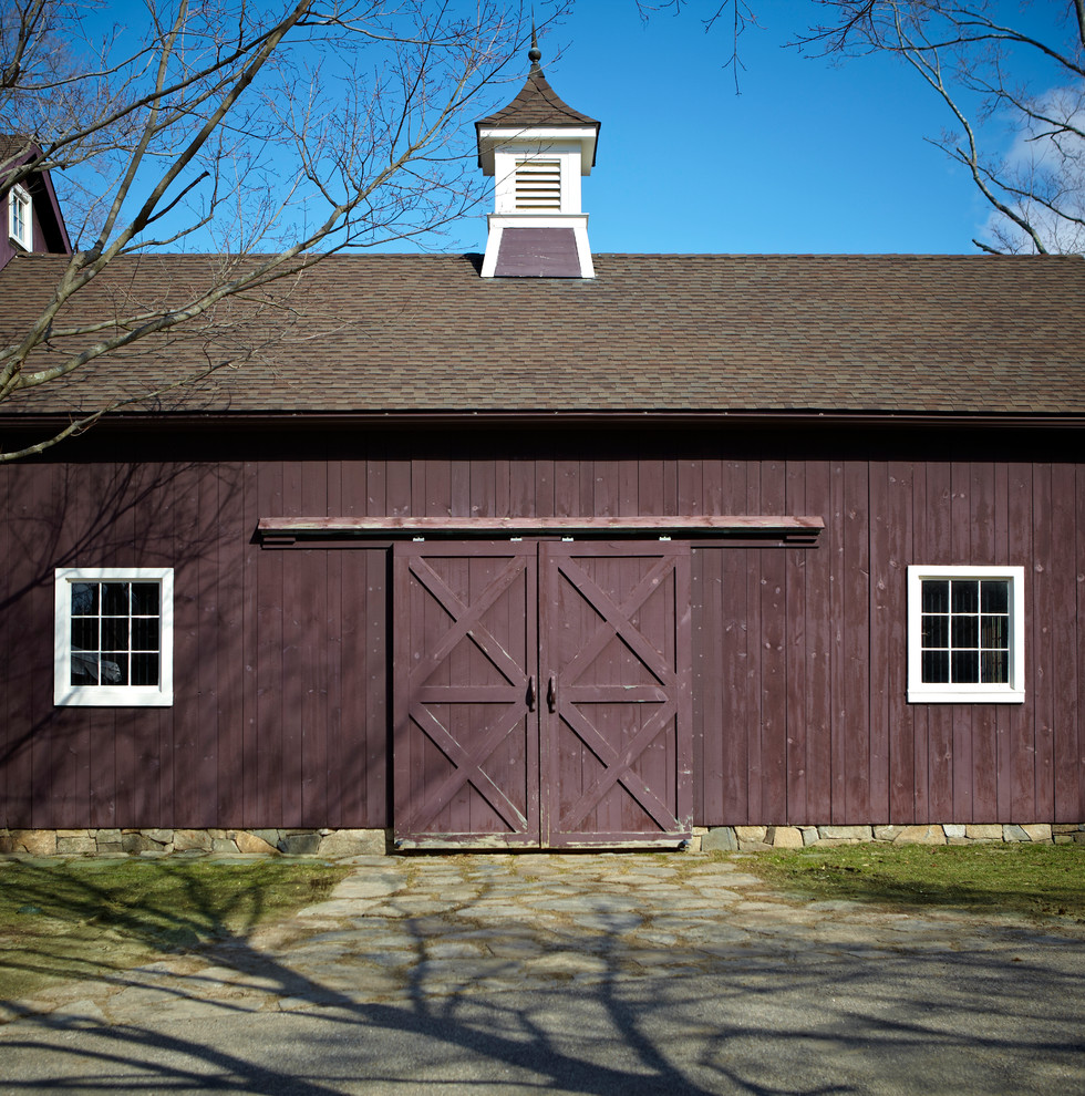 This is an example of a country exterior in New York with wood siding.