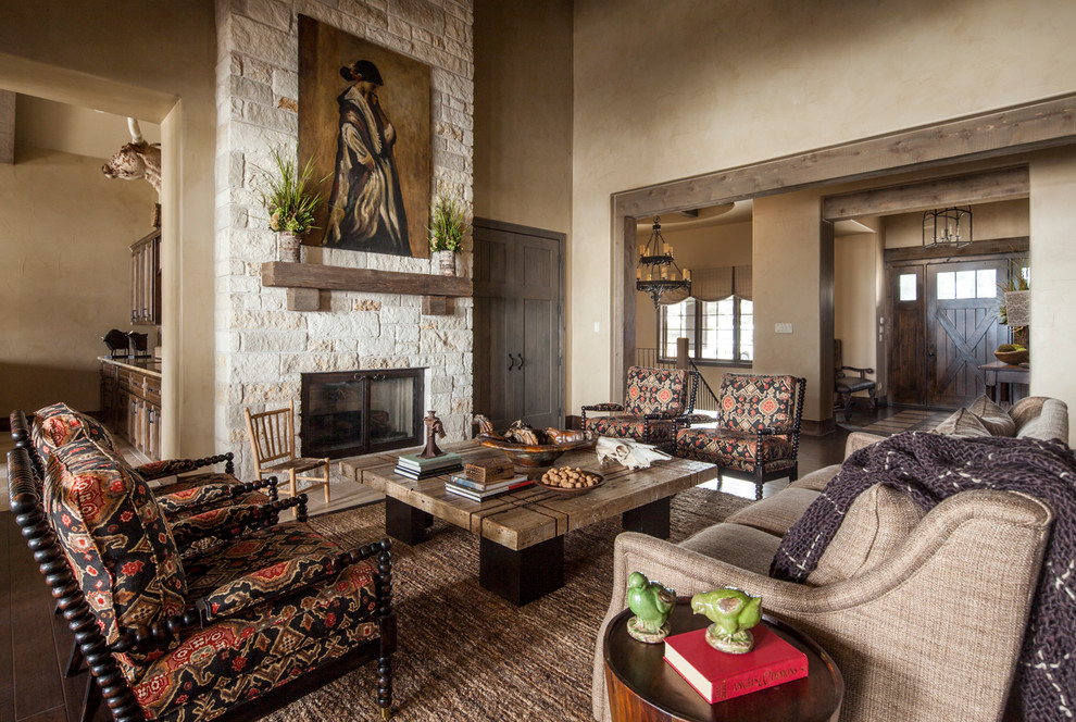 This is an example of a country formal open concept living room in Austin with beige walls, a ribbon fireplace, a stone fireplace surround and no tv.