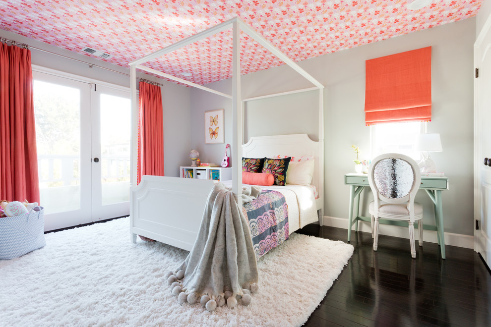 Design ideas for a large transitional kids' room for girls in Los Angeles with grey walls and dark hardwood floors.