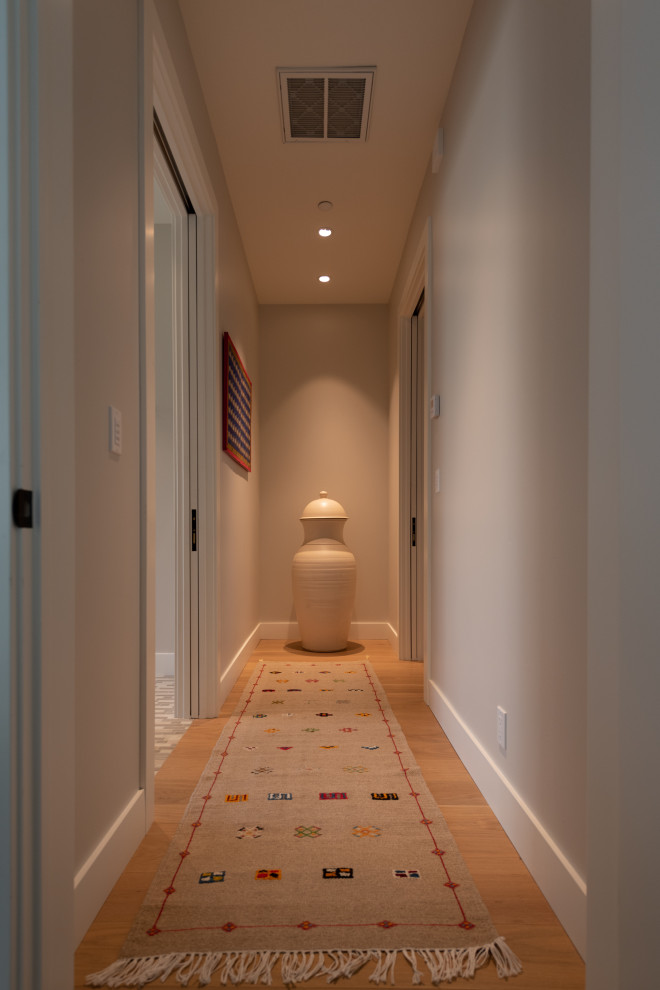 St. Andrews Napa CA Rebuild - This home in Napa off Silverado was rebuilt after burning down in the 2017 fires. Architect David Rulon, a former associate of Howard Backen, known for this Napa Valley industrial modern farmhouse style. Composed in mostly a neutral palette, the bones of this house are bathed in diffused natural light pouring in through the clerestory windows. Beautiful textures and the layering of pattern with a mix of materials add drama to a neutral backdrop. The homeowners are pleased with their open floor plan and fluid seating areas, which allow them to entertain large gatherings. The result is an engaging space, a personal sanctuary and a true reflection of it's owners' unique aesthetic.
Inspirational features are metal fireplace surround and book cases as well as Beverage Bar shelving done by Wyatt Studio, painted inset style cabinets by Gamma, moroccan CLE tile backsplash and quartzite countertops.