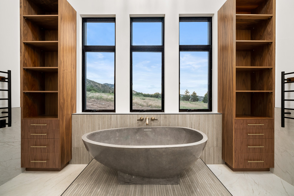This is an example of a large midcentury master wet room bathroom in Denver with flat-panel cabinets, dark wood cabinets, a freestanding tub, a wall-mount toilet, white tile, ceramic tile, white walls, ceramic floors, an undermount sink, engineered quartz benchtops, white floor, an open shower, white benchtops, an enclosed toilet, a double vanity, a built-in vanity and exposed beam.