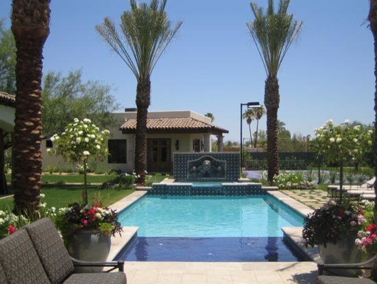 Hot tub - mid-sized transitional backyard stone and rectangular lap hot tub idea in Phoenix