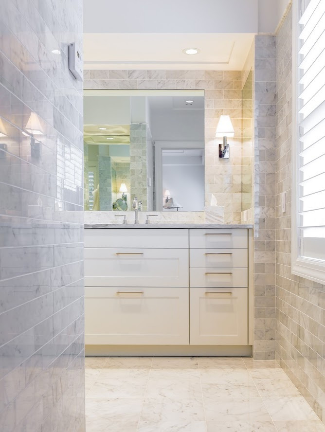 Inspiration for an expansive modern bathroom in New York with shaker cabinets and white cabinets.