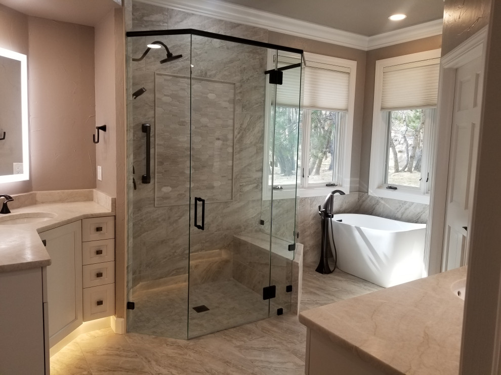Example of a transitional home design design in Denver