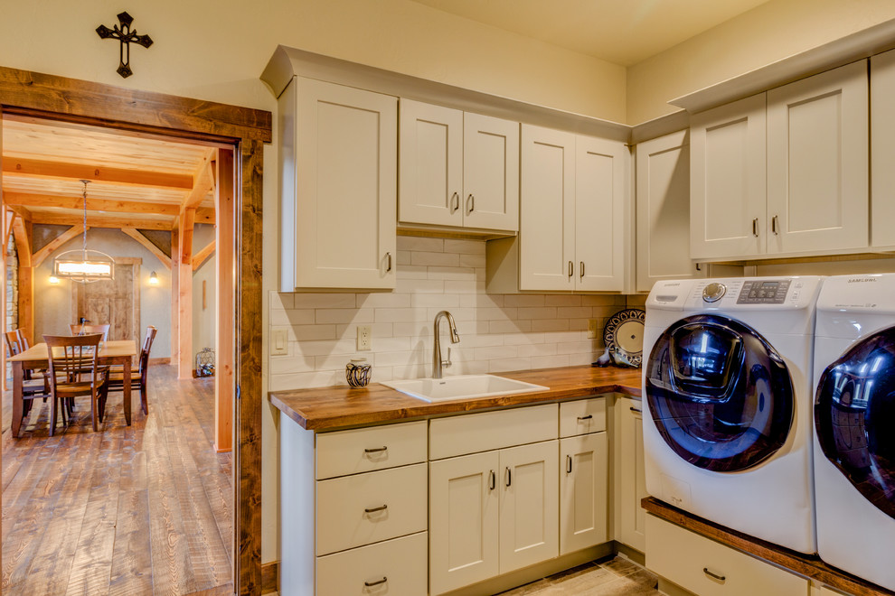 Inspiration for a rustic laundry room remodel in Denver