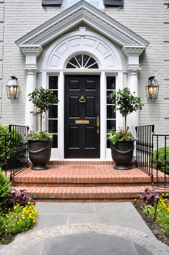 Photo of a traditional entryway in DC Metro with a black front door.