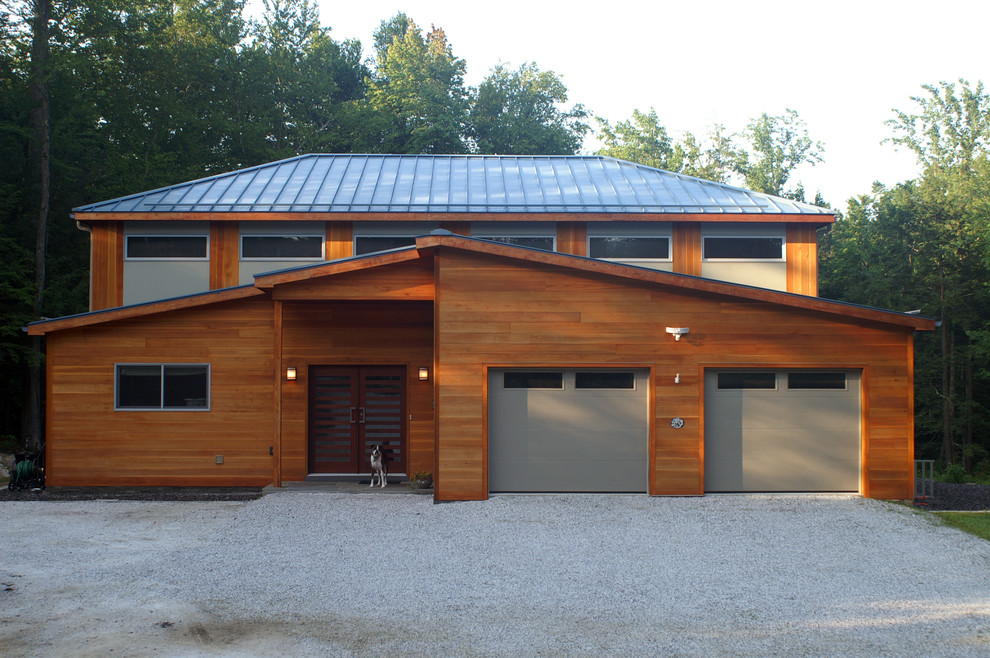 This is an example of a contemporary two-storey brown exterior in Bridgeport with wood siding.