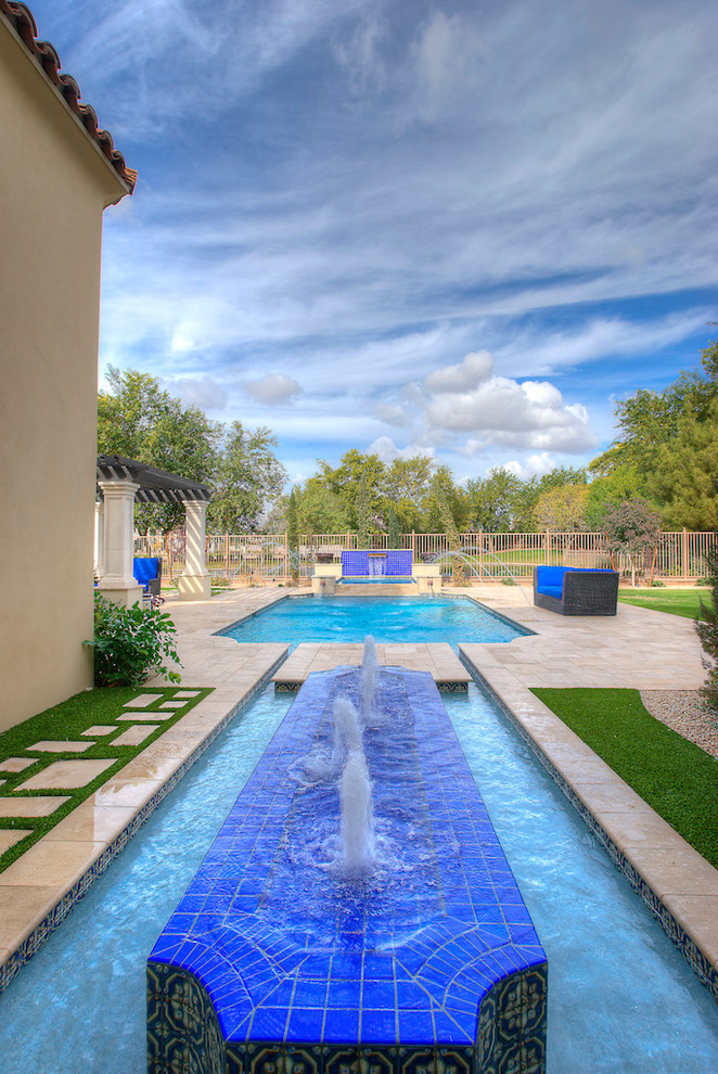 Pool fountain - huge transitional backyard concrete paver and rectangular lap pool fountain idea in Phoenix