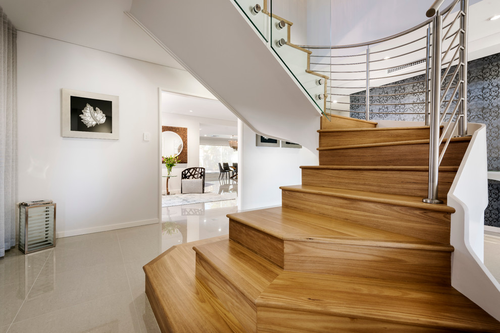Design ideas for a large contemporary wood spiral staircase in Perth with wood risers and mixed railing.