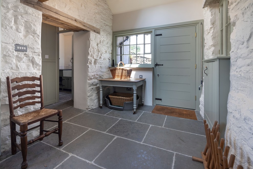 Design ideas for a large country galley dedicated laundry room in Other with a farmhouse sink, shaker cabinets, green cabinets, granite benchtops, white walls, slate floors, a concealed washer and dryer, blue floor and grey benchtop.