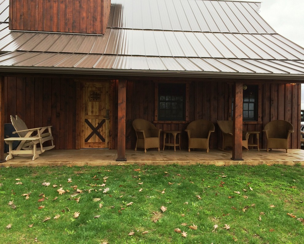 Mid-sized rustic brown two-story wood gable roof idea with a metal roof