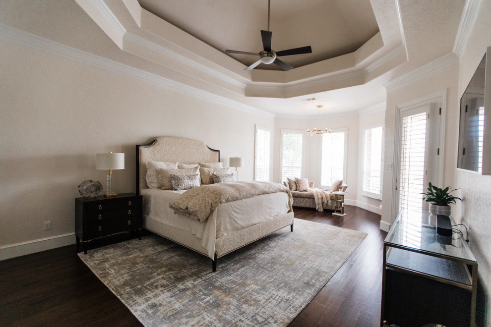 Photo of a large transitional master bedroom in Dallas with beige walls, dark hardwood floors, brown floor and recessed.