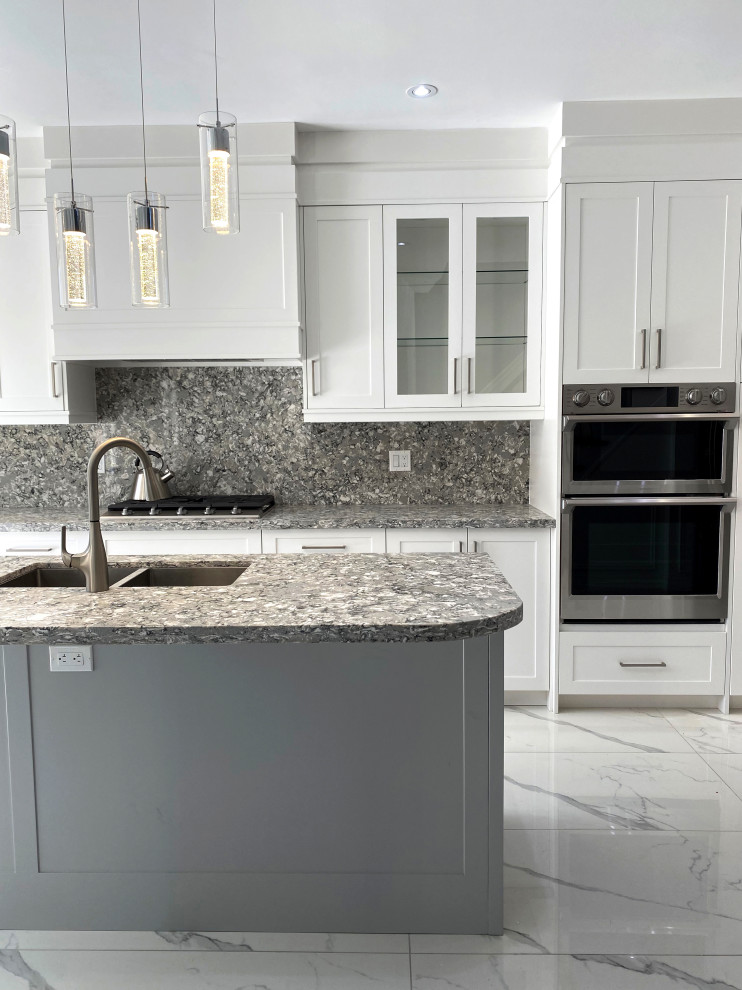 Large transitional l-shaped eat-in kitchen photo in Toronto with flat-panel cabinets, white cabinets and an island