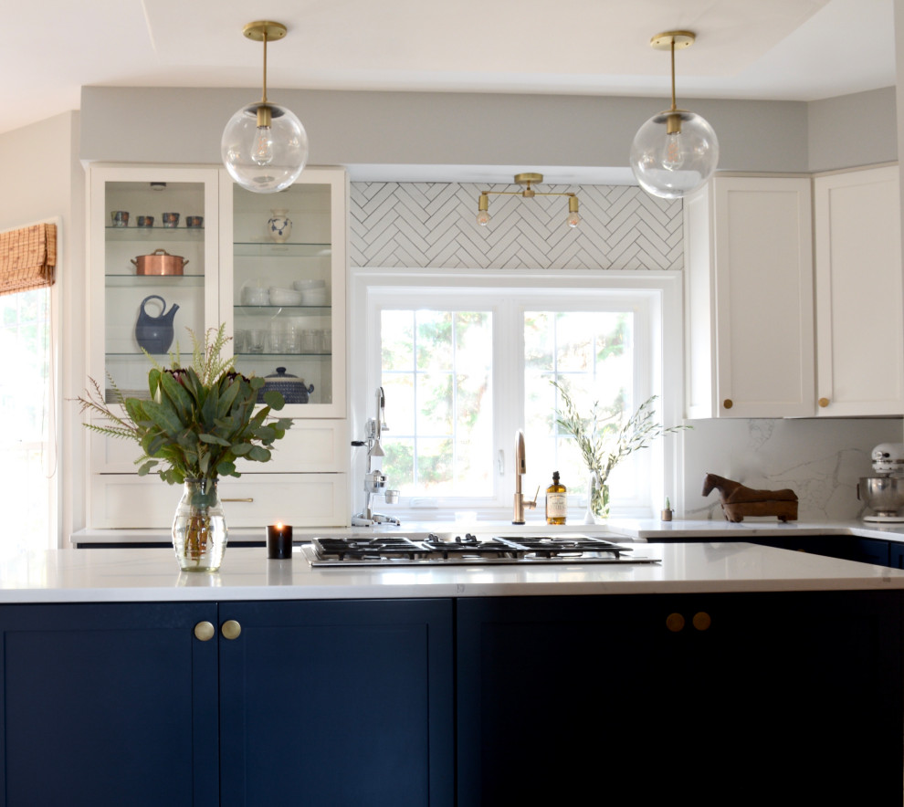 Example of a transitional kitchen design with marble countertops and ceramic backsplash